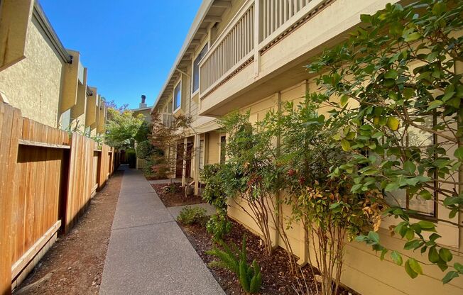 Updated Midtown 2 Bedroom Townhouse in Gated Community with Off-Street Parking