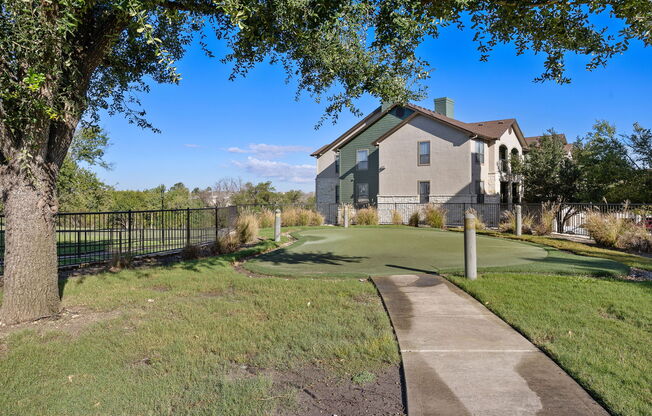 a golf course in front of a house at The Fairways at Star Ranch, Hutto, Texas