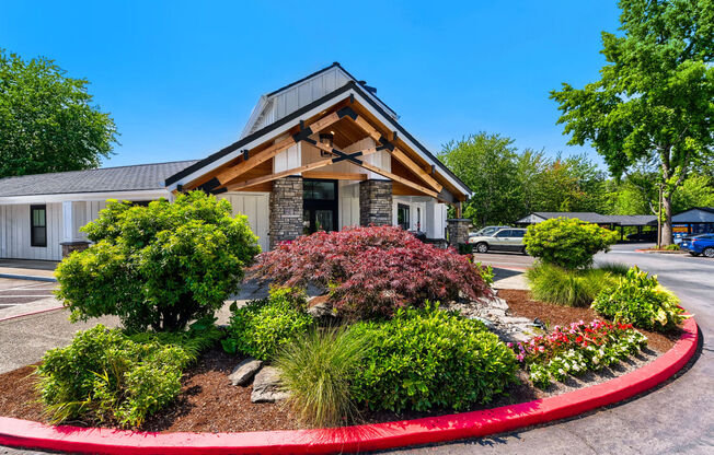 Lake Oswego OR Apartments for Rent - Westlake Meadows - Property Exterior with Brick Details and View of Landscaped Garden and Greens