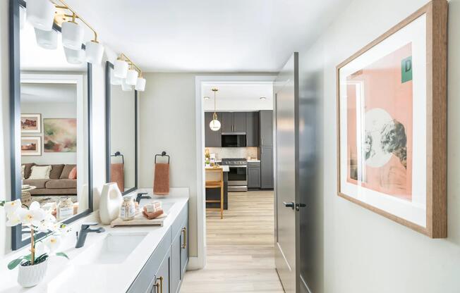 Modern vanities with designer lighting and elevated finishes bring style and function to your daily routine.