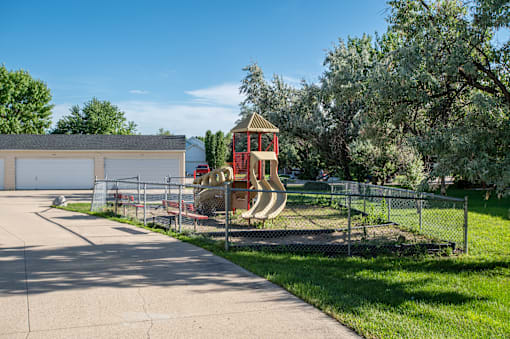 a playground in the backyard of a home