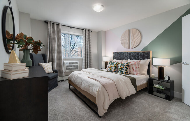 a bedroom with a bed and a window at The Heights Apartments, Cincinnati
