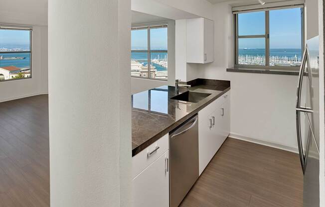A kitchen with a view of the ocean.