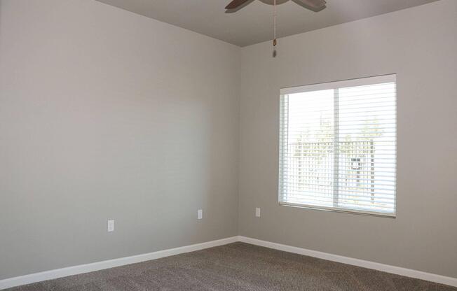 a bedroom with a large window