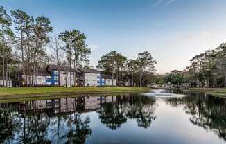 a view of a lake near a building  at Northlake Apartments, Jacksonville, Florida