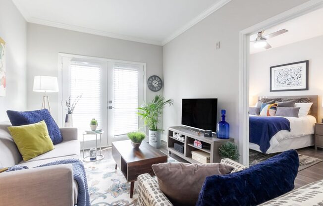 a living room with a couch and a tv