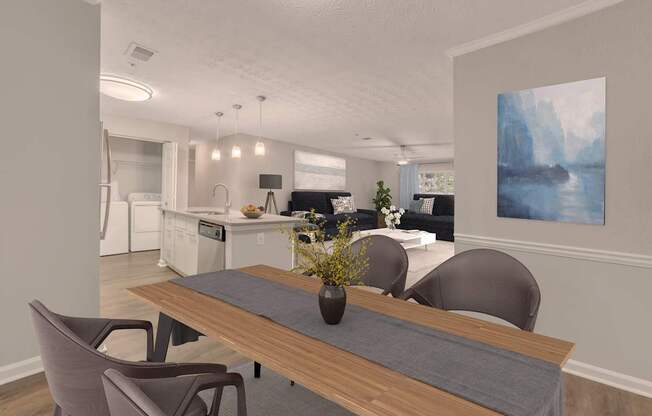 A modern kitchen with a dining table and chairs.