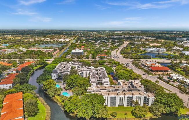 A river flows through a city with apartment buildings on either side.