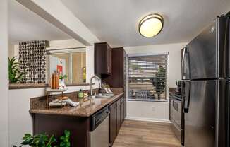 Kitchen with stainless steel appliances and granite counter tops and a window