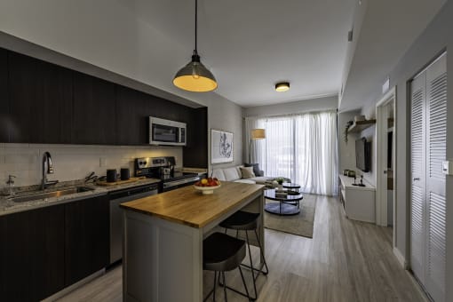 a kitchen and living room in an apartment