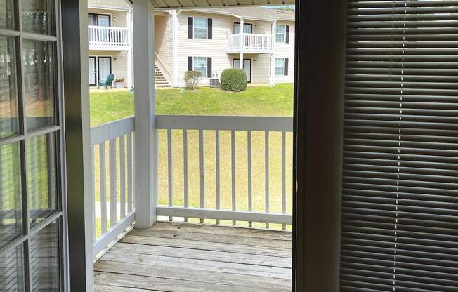 double doors leading to private deck overlooking community