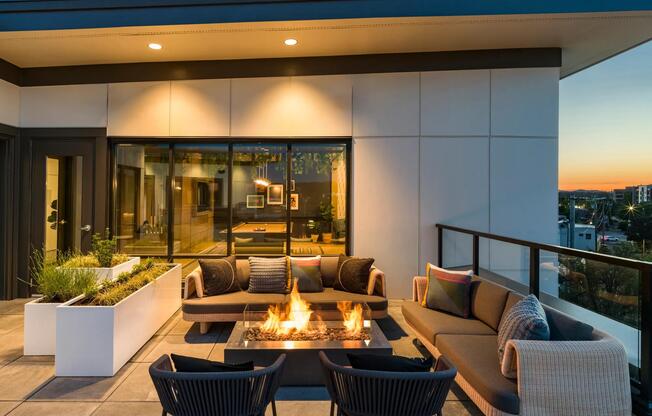 Experience the peak of sophisticated outdoor living at Modera Beaverton's incredible rooftop deck and bar lounge.