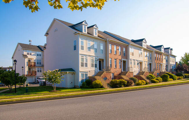 a row of houses on the side of a street