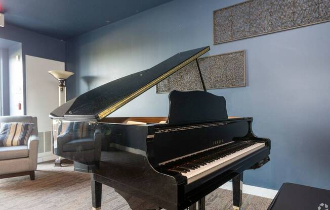 Grand Piano in common area at Waterside at RiverPark Place Louisville Apartments