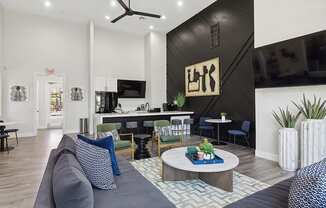 Community Clubhouse with Lounge Furniture, TV & Kitchenette Area at Monterra Apartments located in Las Vegas, NV.