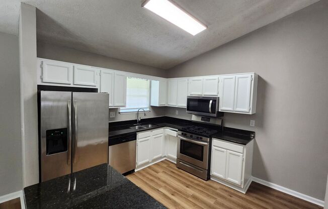 Spacious 4BR Split-Level Home with Fireplace & 2-Car Garage