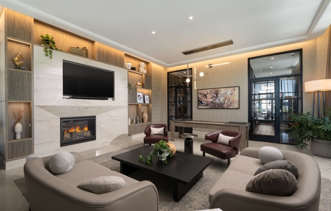 a living room filled with furniture and a large fireplace