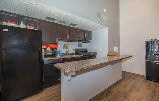 a large kitchen with stainless steel appliances