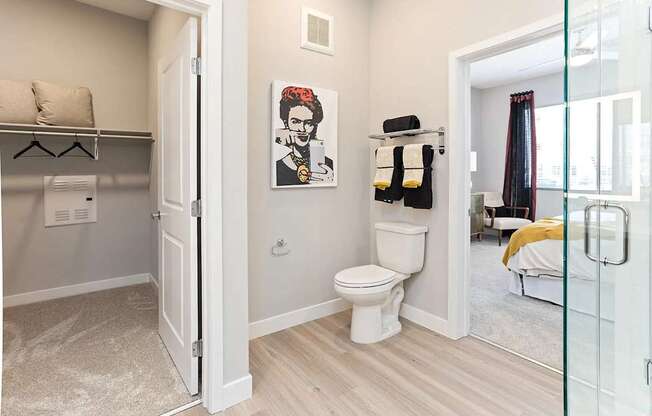 A bathroom with a white toilet and a white door.