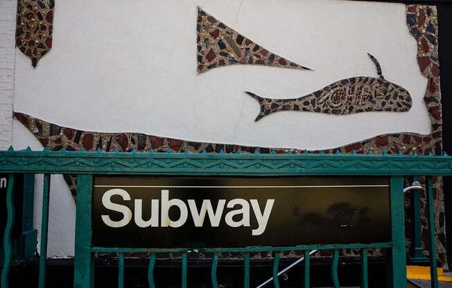 a sign for a subway store with fish on it at The Paxton, Brooklyn
