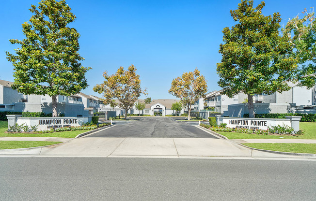 a street with houses and trees on either side of a road