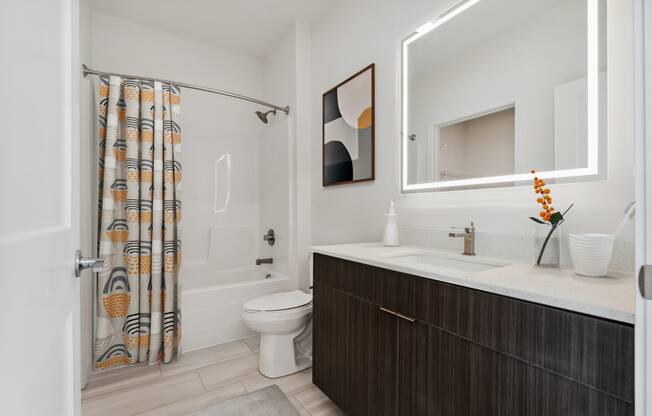 a bathroom with a toilet sink and shower at The Box, Richmond, 23224