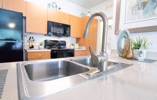 a kitchen with a sink and a faucet