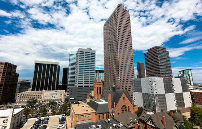 an aerial view of the city with tall buildings and skyscrapers