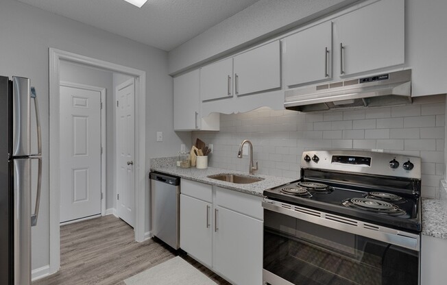 Elevate your living at Icon Downtown Durham with this sleek and modern kitchen featuring stainless steel appliances, ample storage, and stylish finishes. Perfect for culinary enthusiasts and entertaining guests. Explore your new home today!
