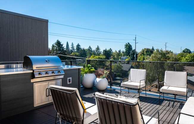 Southeast Portland, OR Pet-Friendly Apartments - The Lenox - Rooftop Lounge with Lounge Seating, Grill Station, and Neighborhood Views