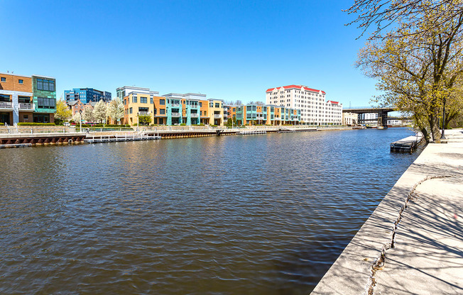 a body of water with buildings on the side of it