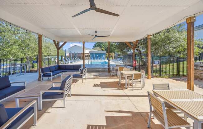 the pool area at the preserve at ballantyne commons with tables and chairs