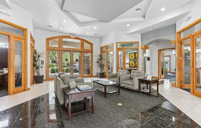 A spacious lobby with a coffee table and couches.