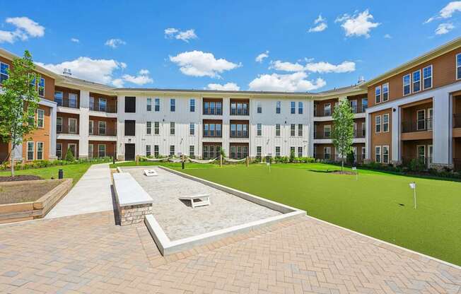 The courtyard with bocce, cornhole, hammocks, and mini golf