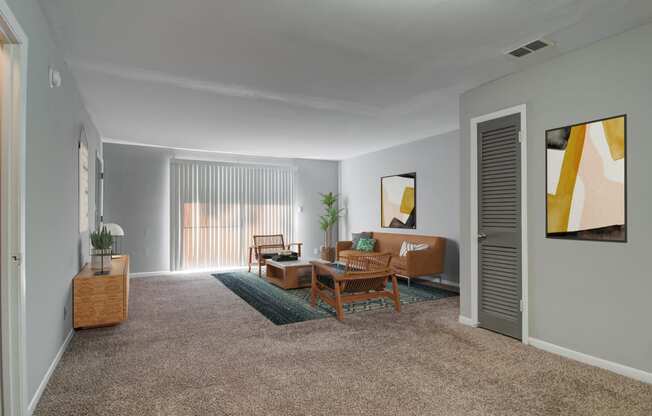 a living room with gray walls and a carpeted floor