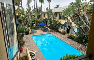 Upper 2-Bedroom Spanish-Style Apartment with A/C, Pool & Gated Parking
