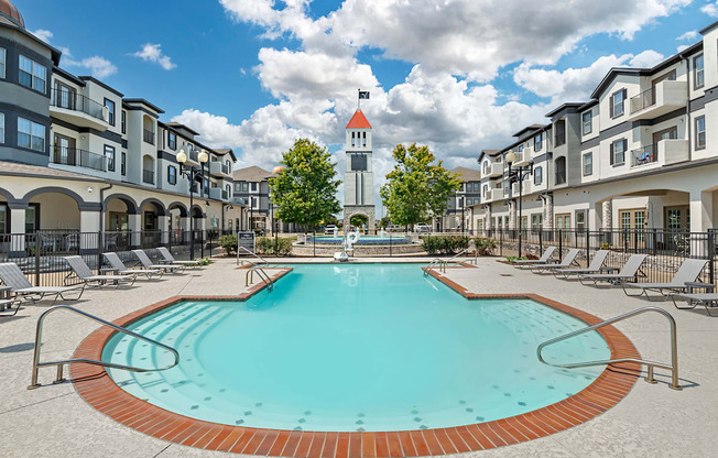 our apartments have a large pool with a church tower in the background