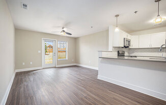 Open living room with a ceiling fan