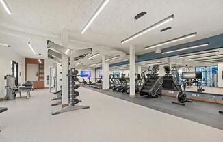 Club-quality fitness studio with TRX station and spin bikes.