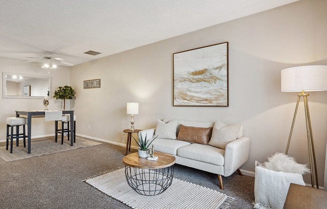 a living room with a couch and a table