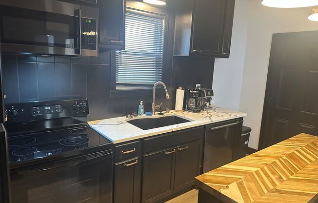 Beautifully Remodeled 2-Bedroom with Bonus Room, 2 Baths & Prime Amenities