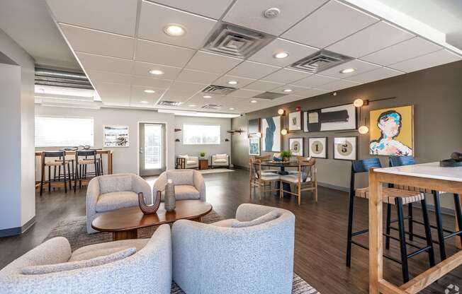 a common room with chairs and tables in a healthcare facility