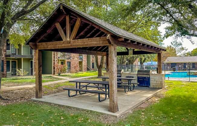 a picnic area with a picnic table in a park