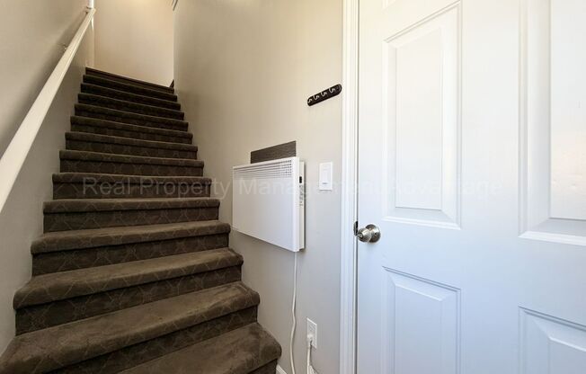 Rare Corner Upper Condo with Vaulted Ceilings, Private Balcony and 2 Car Garage - Right Across from the GM Tech Center!