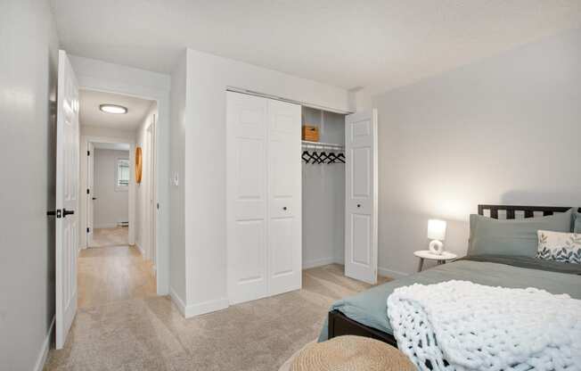 a bedroom with a bed and a hallway with closets at Brix, Walla Walla, WA, 99362
