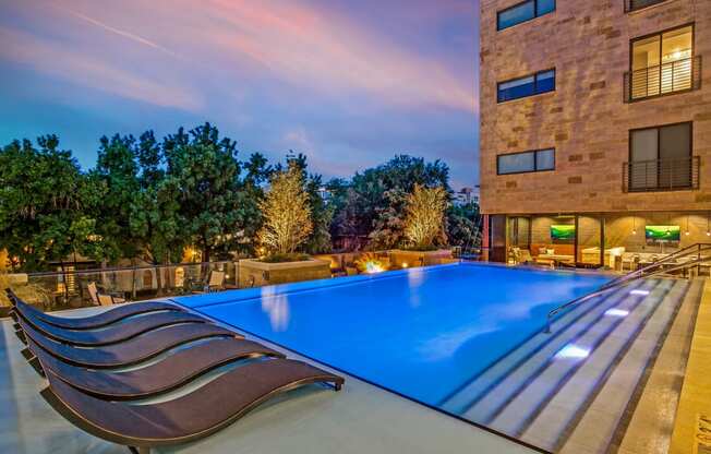 a swimming pool in front of a building