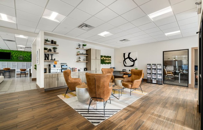 the waiting room of a salon with chairs and a table