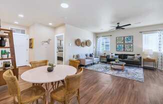 a living room with a dining table and a couchat Solace at Ballpark Village, Goodyear, AZ, 85338