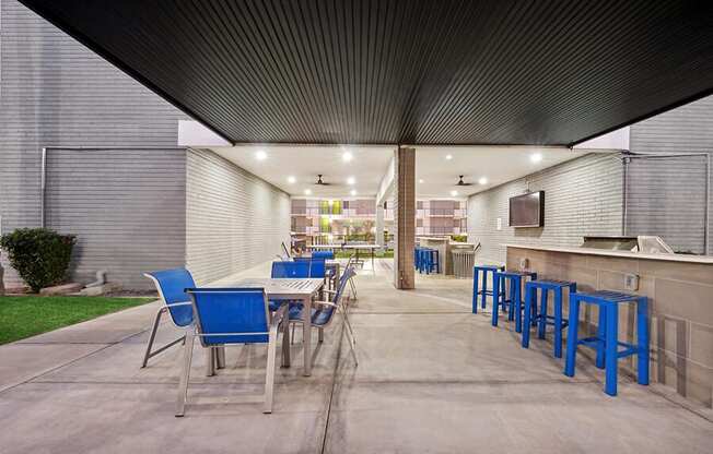 Outdoor BBQ Area with Furniture at Arcadia on 49th Apartments located in Phoenix, AZ.