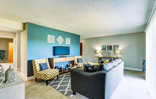 Living room in a Signature series 2-bed, 2-bath apartment at Somerset Lakes, offering a spacious layout.